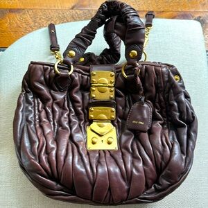 Miu Miu burgundy leather bag with gold hardware